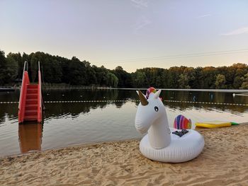 View of inflatable swan on the beach
