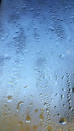 Full frame shot of raindrops on window