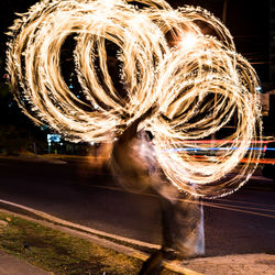 Light painting against sky at night