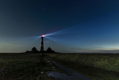 Panoramic view of the lighthouse westerhever at night.