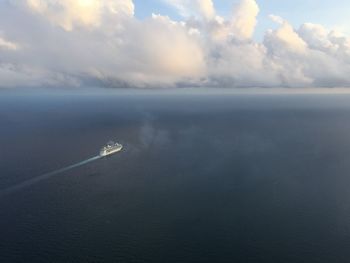 Scenic view of sea against cloudy sky