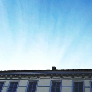 Low angle view of building against blue sky