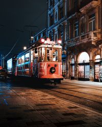 Cars on illuminated city at night