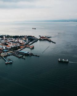 High angle view of harbor by sea against sky