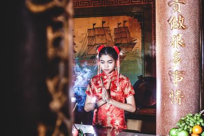 Portrait of young woman in temple