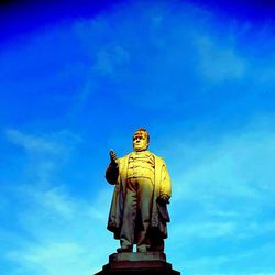 Low angle view of statue against sky