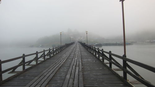 Bridge over sea against sky