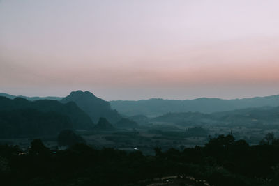 Scenic view of mountains against sky during sunset