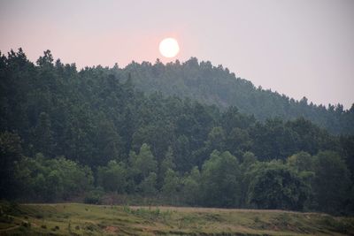 Scenic view of landscape against sky during sunset