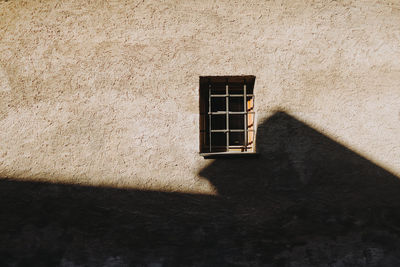 Low angle view of window on wall of building