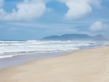 Scenic view of beach against sky