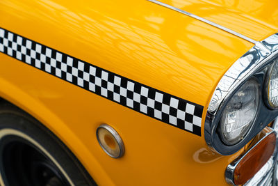 Close-up of yellow car