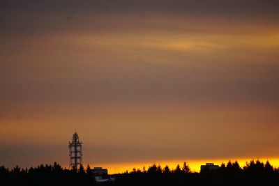 Silhouette trees against sky during sunset