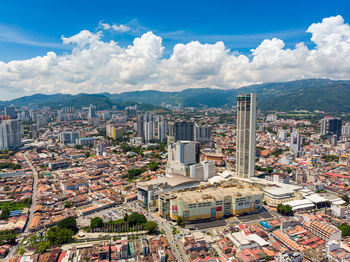 High angle view of buildings in city against sky