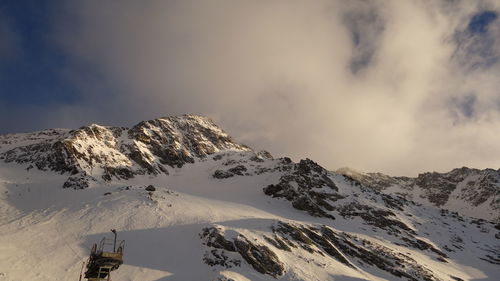 Scenic view of mountains against sky during winter