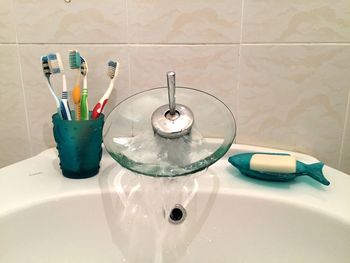 Close-up of faucet in bathroom