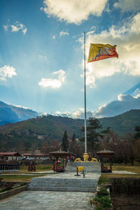 Low angle view of flag against sky