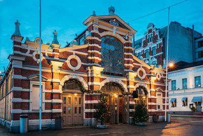 Buildings in city at dusk