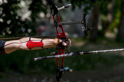 Cropped image of man playing archery
