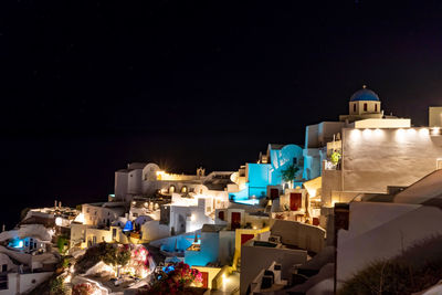 Night falling on the greek village of oia on the island of santorini . typical orthodox church