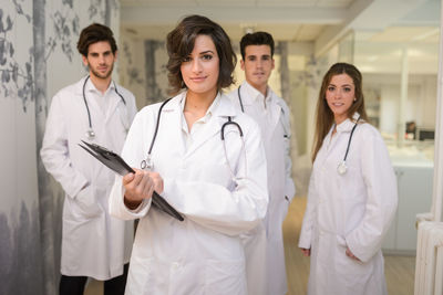 Portrait of doctors standing in hospital