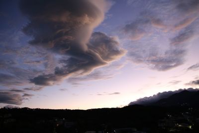 Silhouette landscape against scenic sky