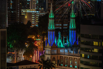 Illuminated buildings in city at night