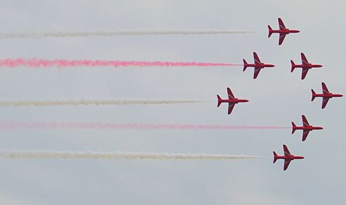 Low angle view of airshow in sky