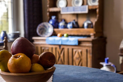 Close-up of apples on table at home