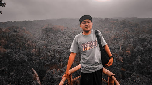 Full length of man standing on mountain