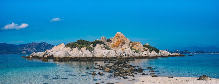 Scenic view of sea against clear blue sky