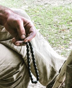 Close-up of man holding hands