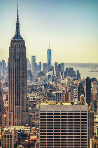 Modern buildings in city against clear sky