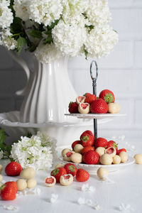 White chocolate covered strawberries, fresh strawberries and white floweers