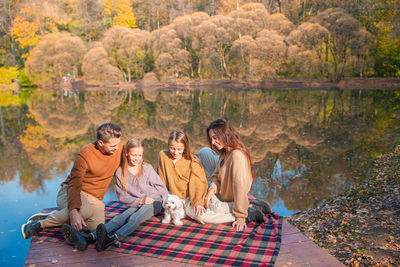 People sitting in forest during autumn