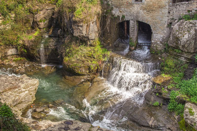 Water flowing through rocks in forest