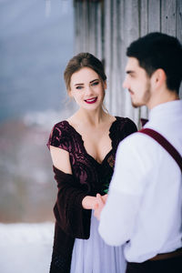 Young couple standing outdoors