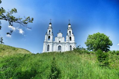 Low angle view of church against blue sky