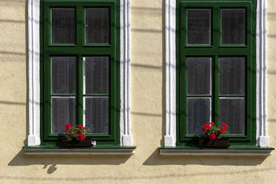 Exterior of house with closed windows during sunny day