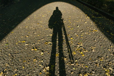 High angle view of person shadow on street