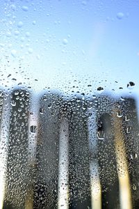 Close-up of raindrops on glass window