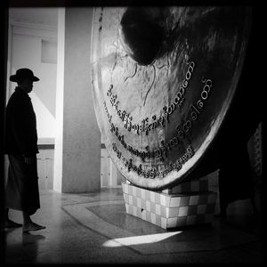 Woman standing against wall