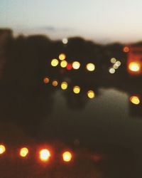 Defocused image of illuminated street lights at night