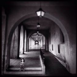 Woman walking in tunnel