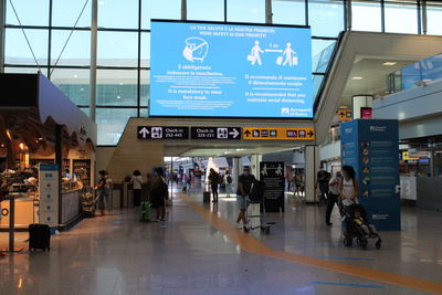 Group of people walking on airport