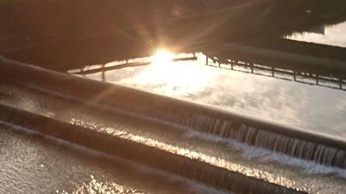 Close-up of illuminated water at sunset