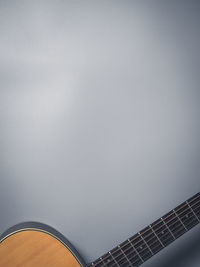 Low angle view of guitar against clear sky