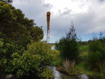 Low angle view of smoke stack against sky