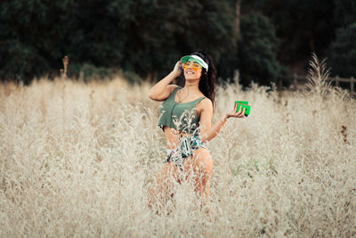 Full length of woman standing on field