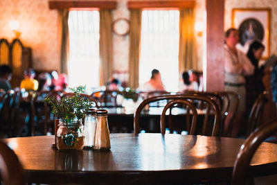 Close-up of chairs and table in restaurant